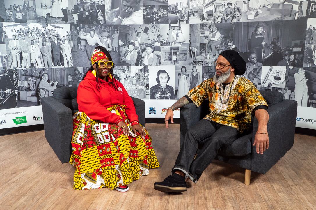 Heru TchaasAmen in a seated panel conversation at the Legacy exhibit
