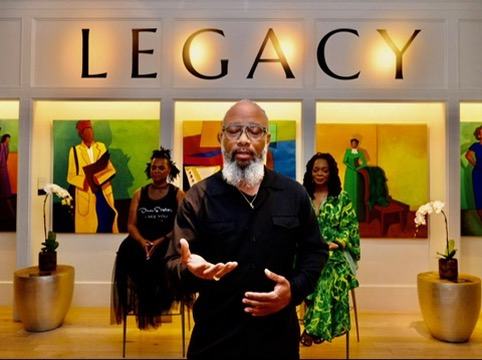 Heru TchaasAmen speaking at the Legacy exhibit